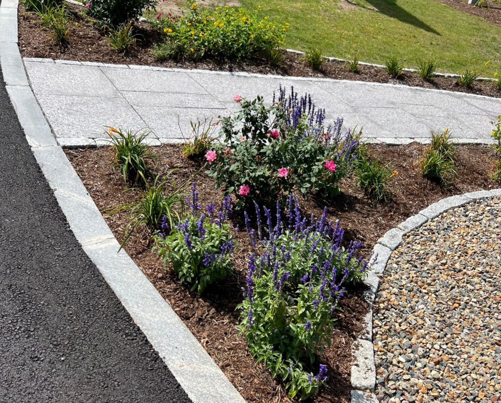 Granite edging for a walkway and cobblestone edging for garden